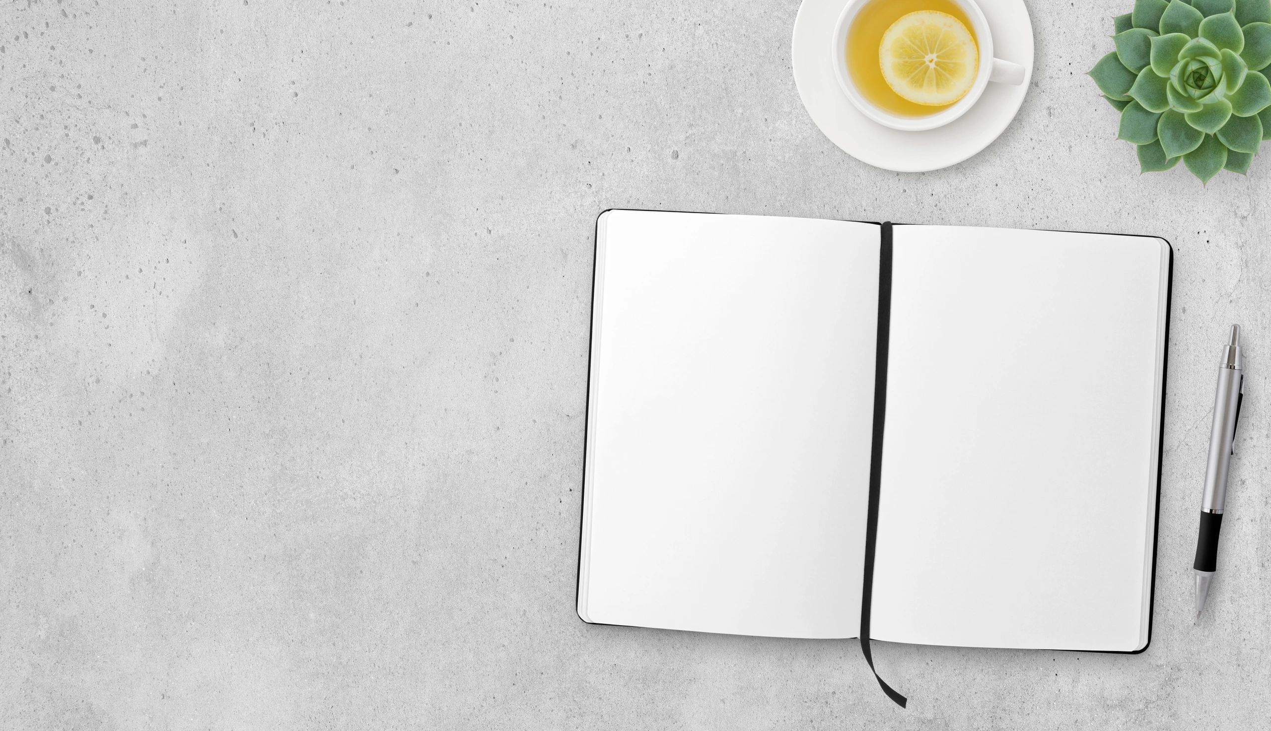 Open book and tea on a table